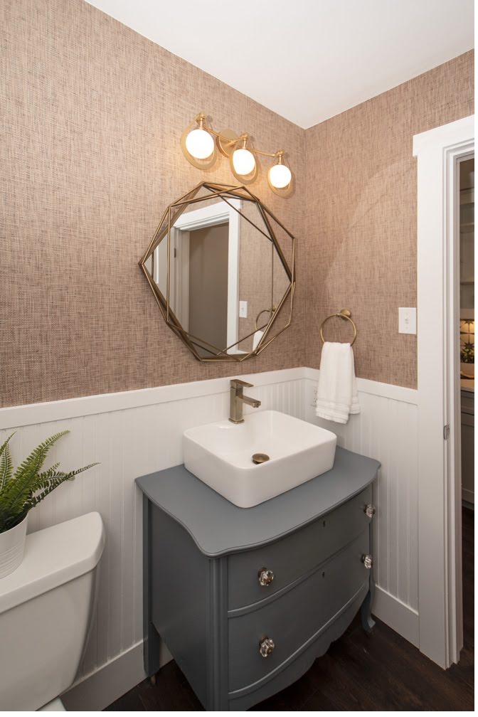 Blush grasscloth powder room