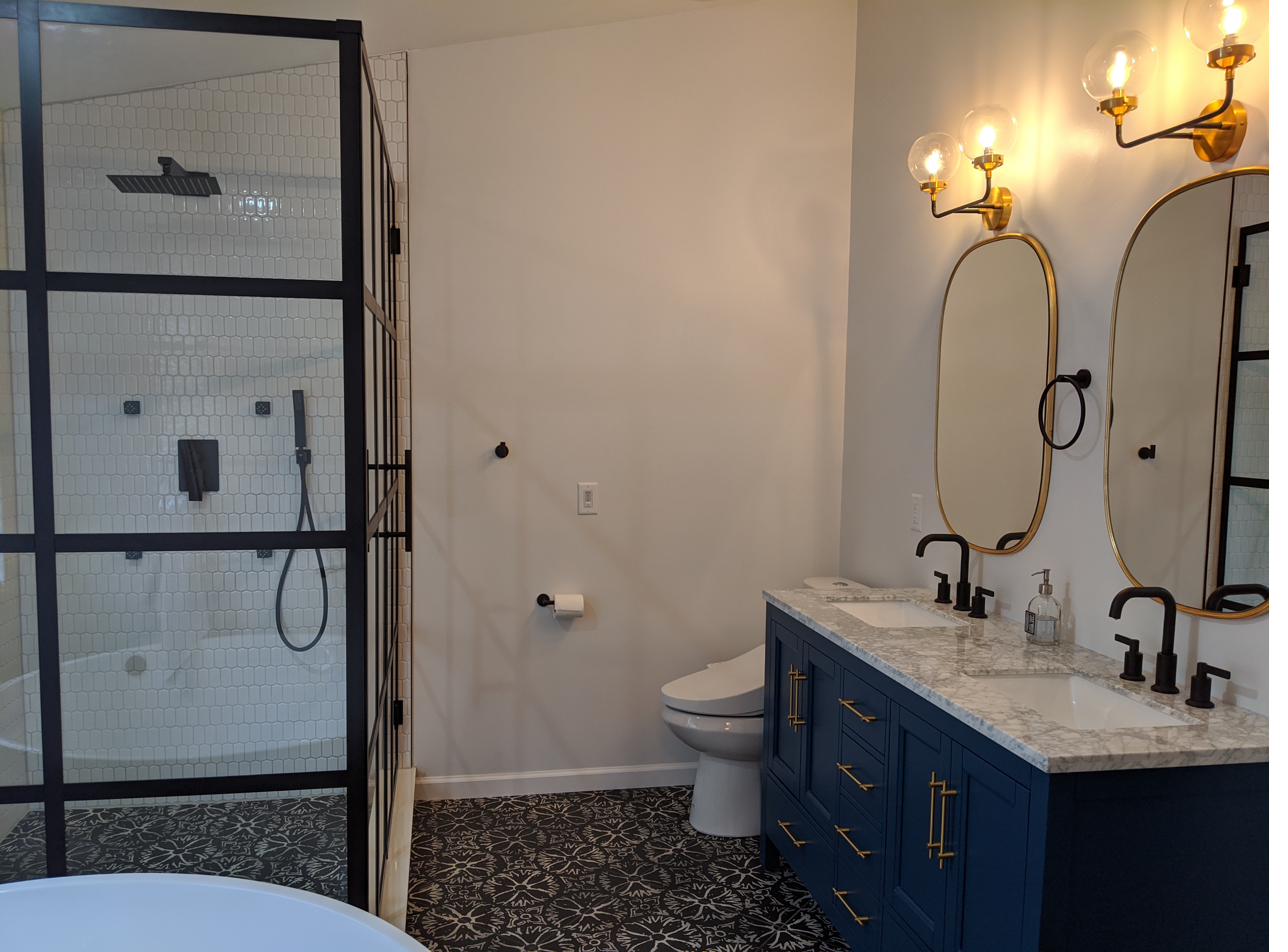 Navy vanity, black grid shower, encaustic floor, view 1 of 6