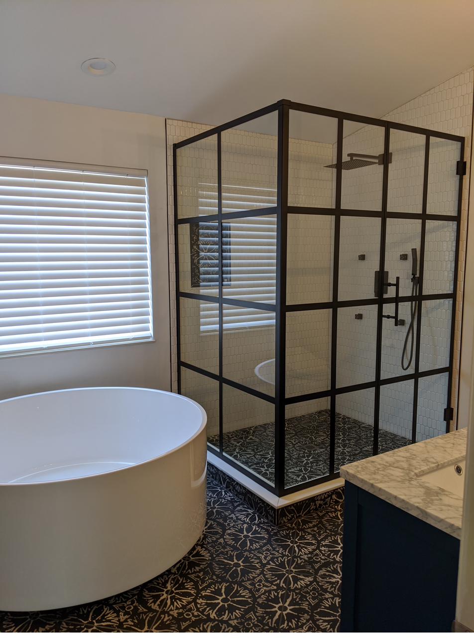 Navy vanity, black grid shower, encaustic floor, view 2 of 6