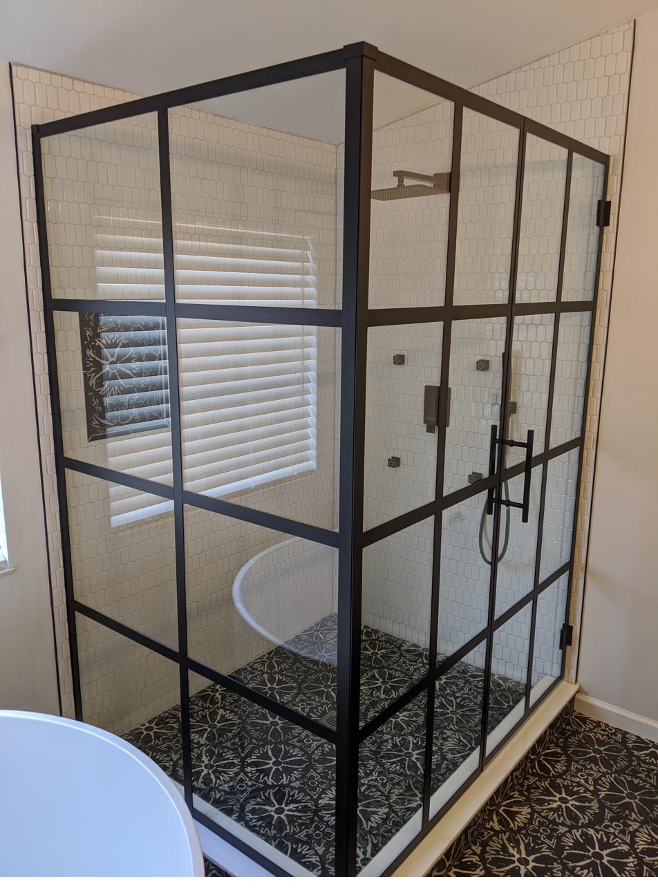 Navy vanity, black grid shower, encaustic floor, view 3 of 6