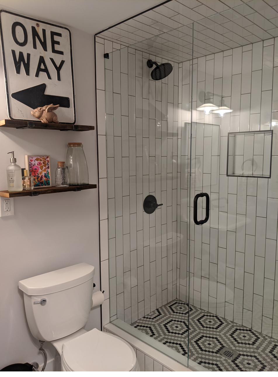 Basement bath, vintage sign & wall-mount sink, view 1 of 2