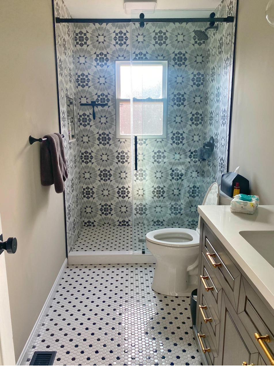 Narrow bath, gray vanity & mosaic floor, view 2 of 2