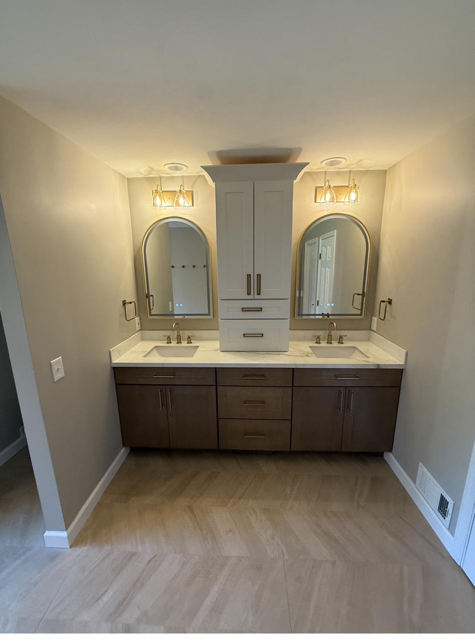 Walnut double vanity, arched mirrors