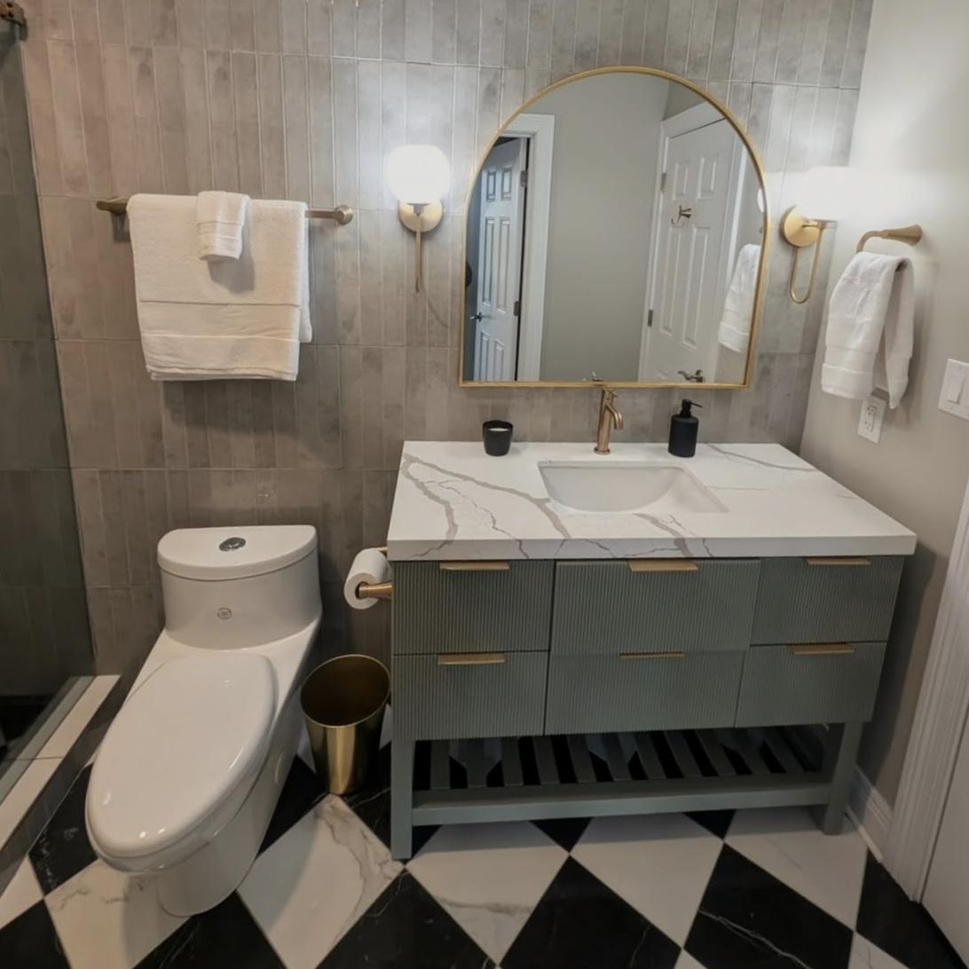 Checkerboard floor bath, quartz waterfall vanity, view 1 of 2
