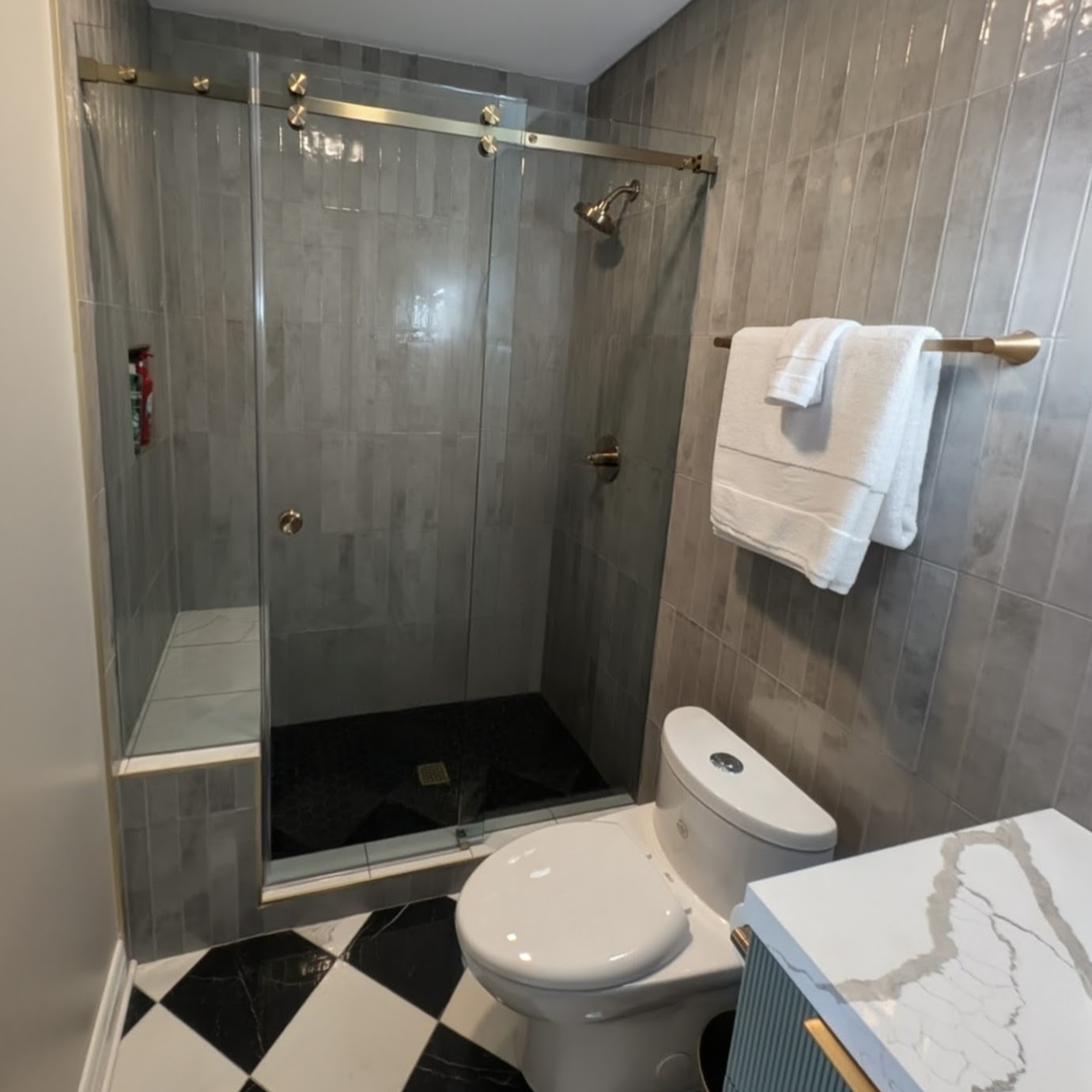 Checkerboard floor bath, quartz waterfall vanity, view 2 of 2