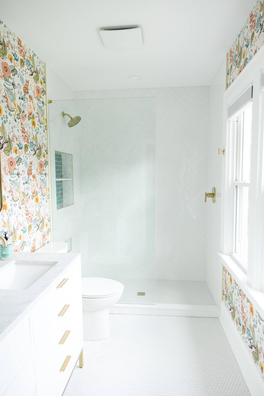 Floral wallpaper bath, white vanity, view 1 of 3