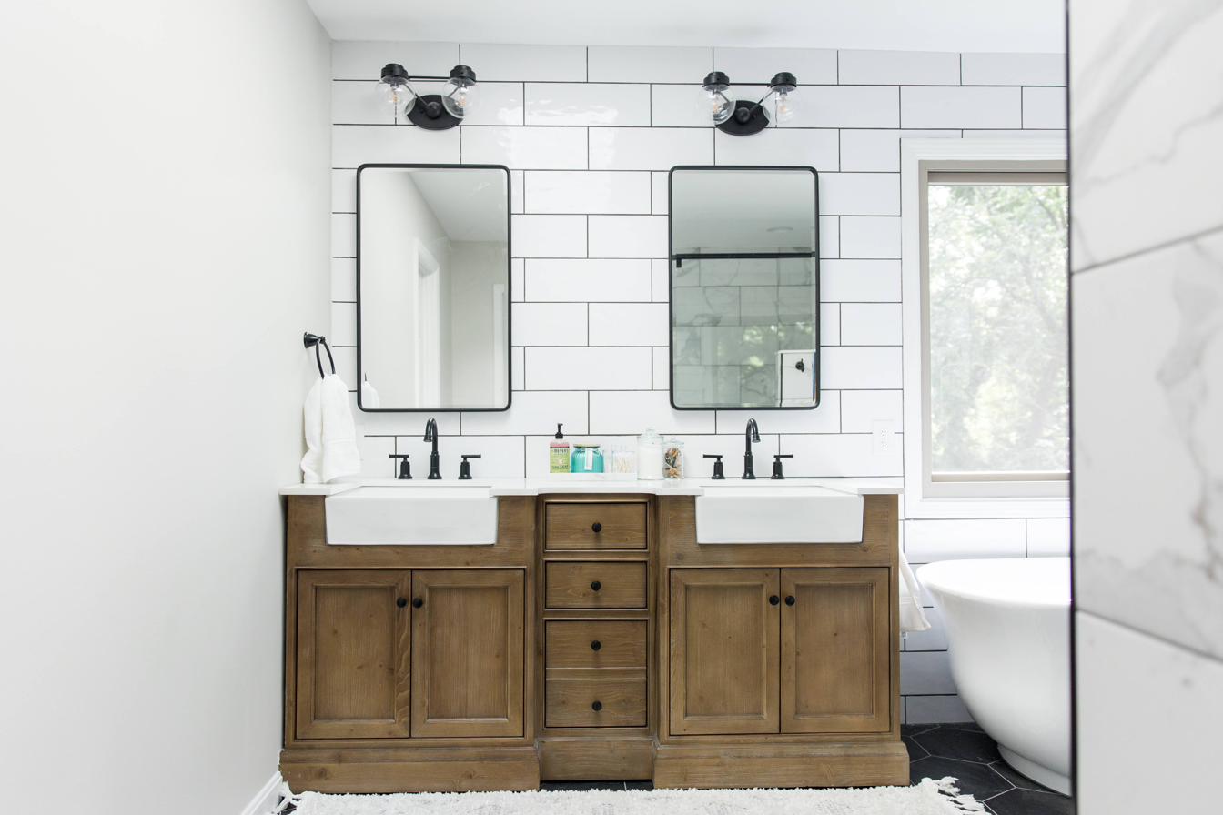 Wood vanity, subway tile & black hex master bath, view 3 of 9