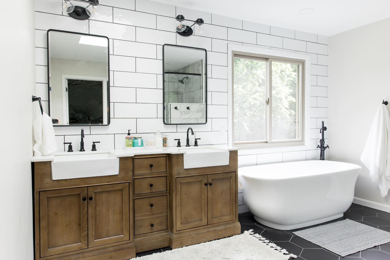 Wood vanity, subway tile & black hex master bath, view 4 of 9