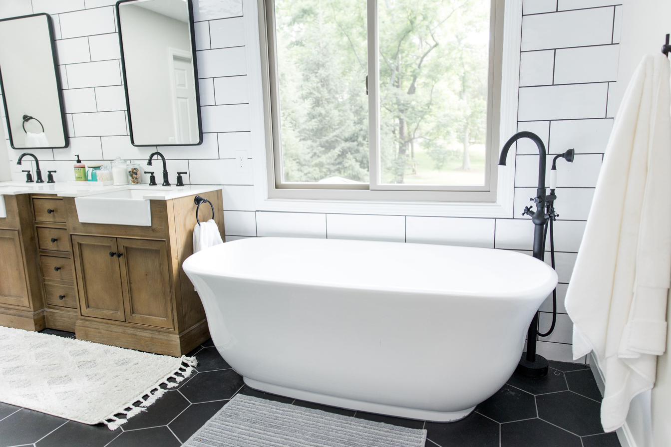 Wood vanity, subway tile & black hex master bath, view 9 of 9