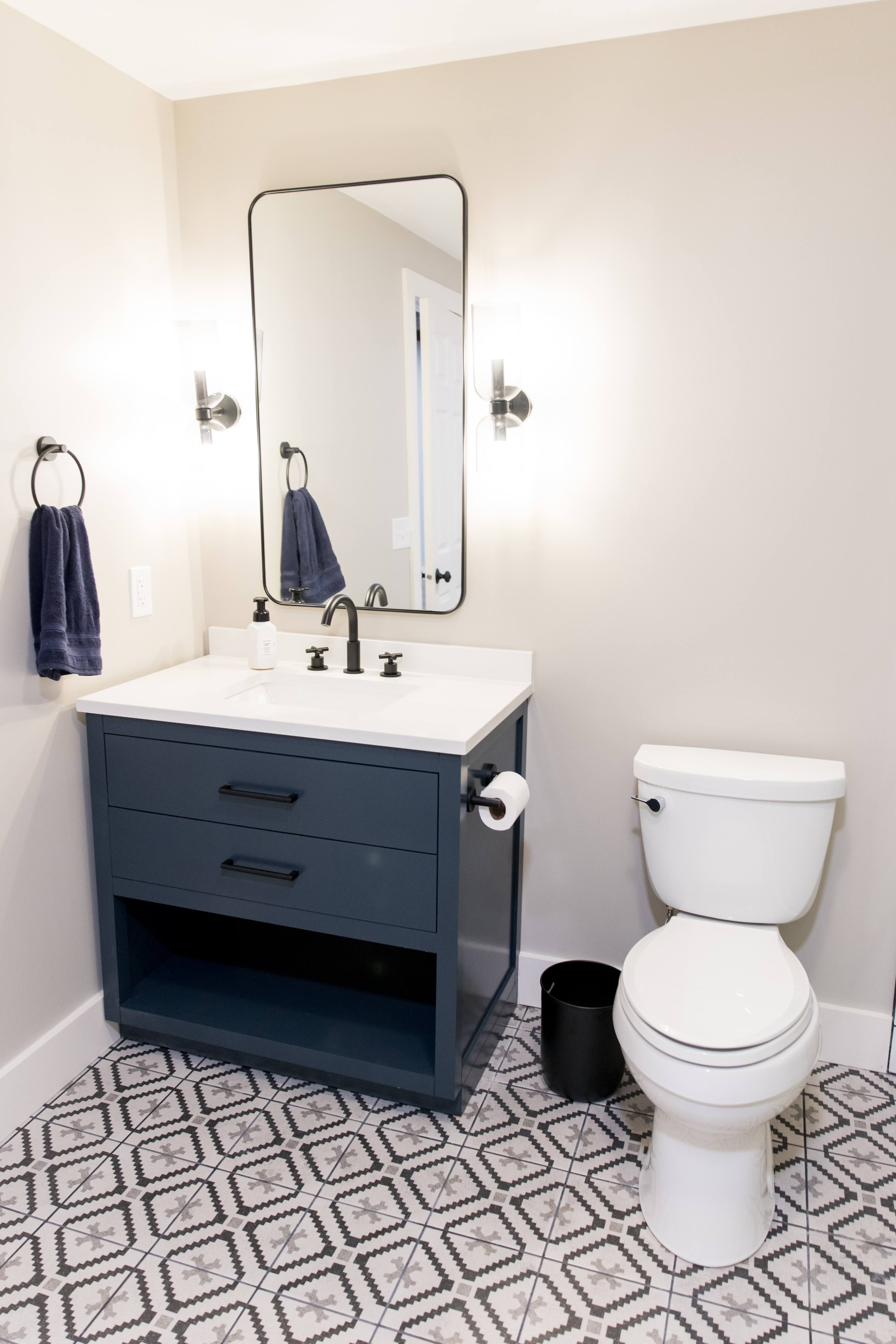 Basement bath, navy vanity & grid shower, view 2 of 2