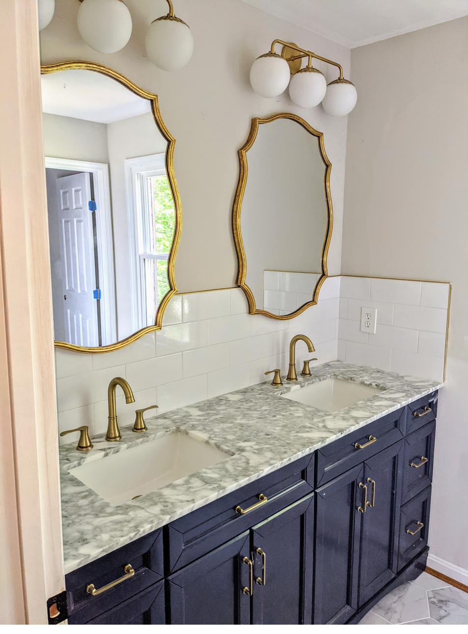 Gold fixtures, blue cabinets, view 1 of 2
