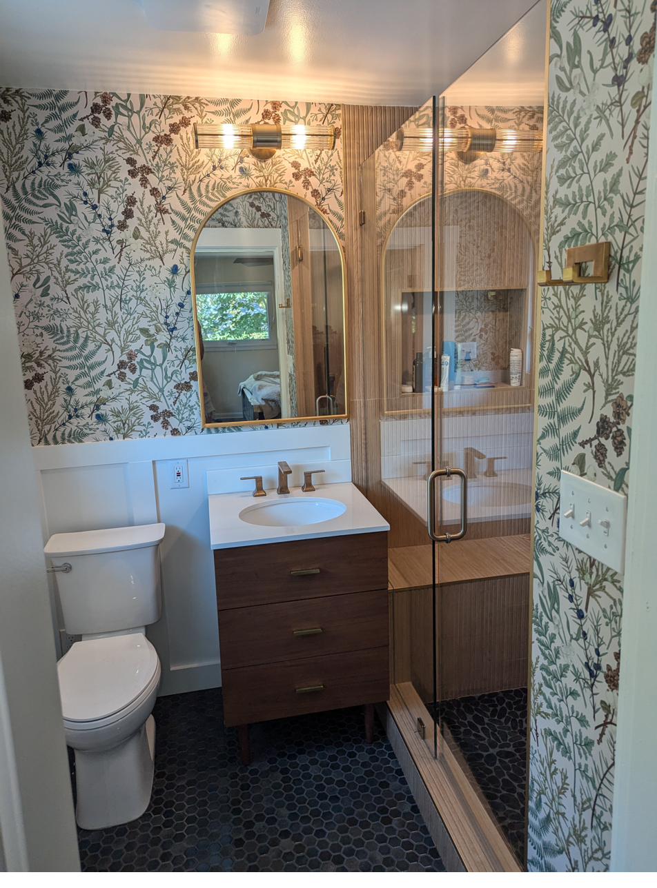 Small white bath, black fixtures