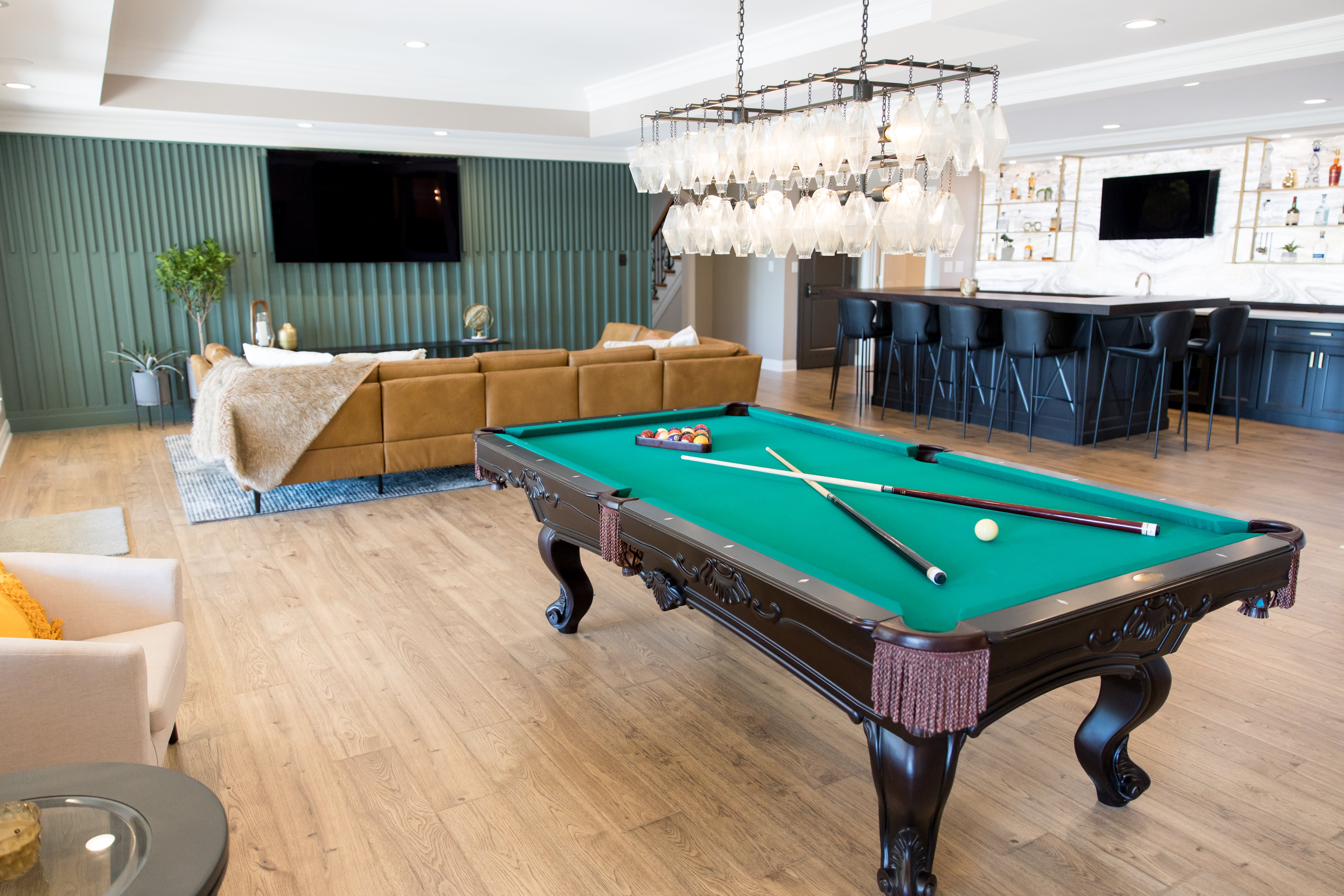Basement entertainment level: bar, billiards, golf sim, putting green, view 1 of 15