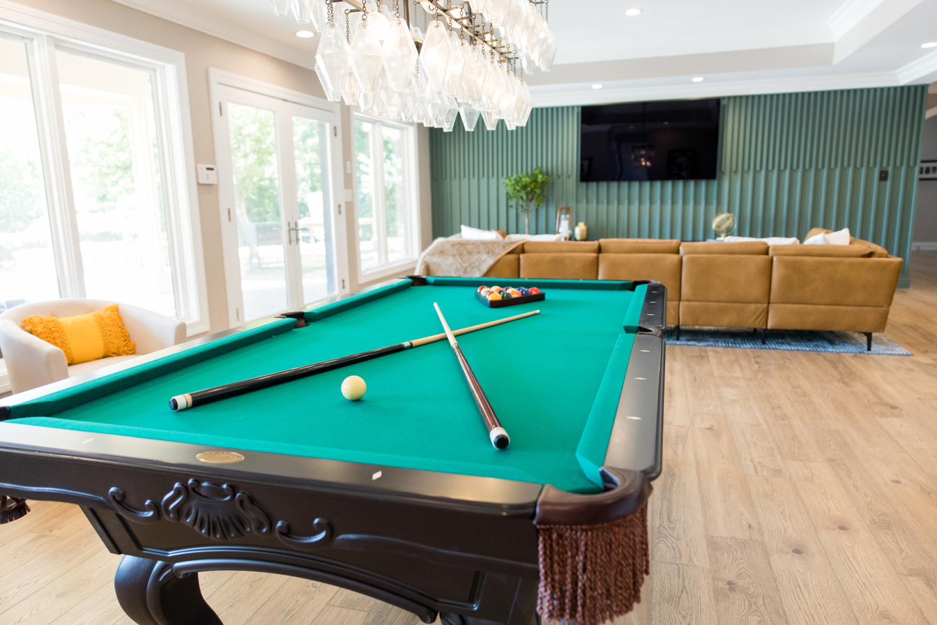 Basement entertainment level: bar, billiards, golf sim, putting green, view 10 of 15