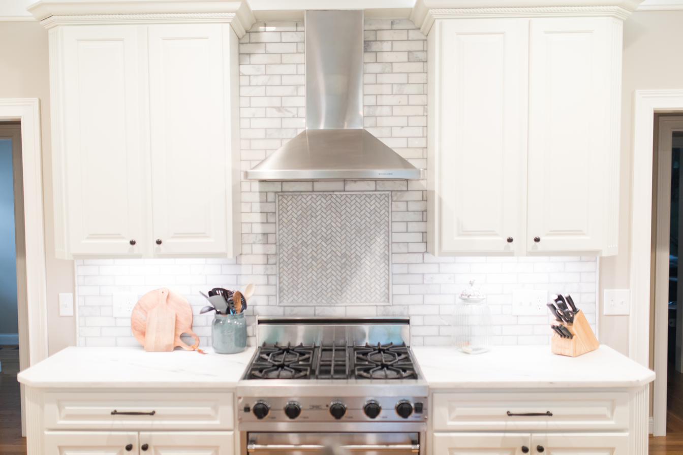 White kitchen, charcoal island, view 1 of 9
