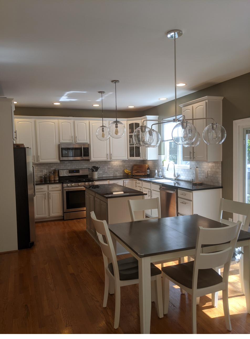 White kitchen with eat-in dining, view 1 of 2