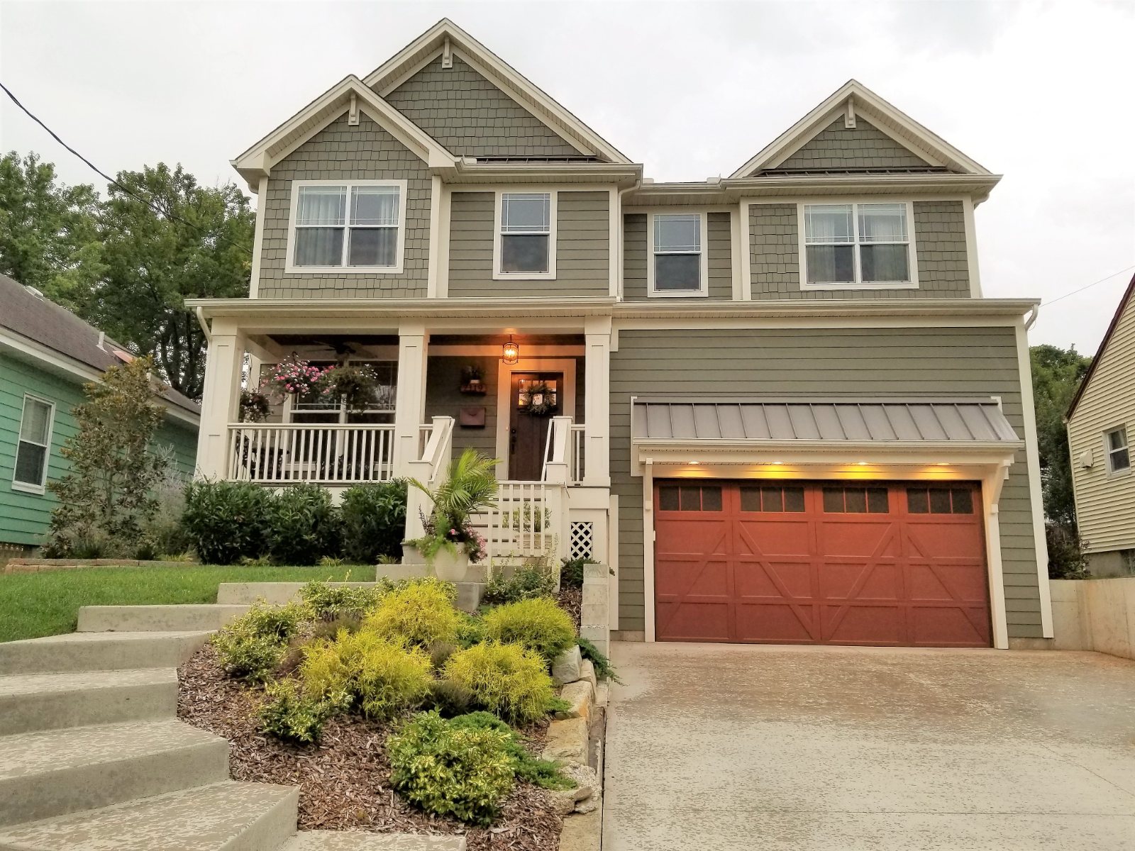 Maple Ave. exterior, a two-story craftsman home with gray siding and a front porch